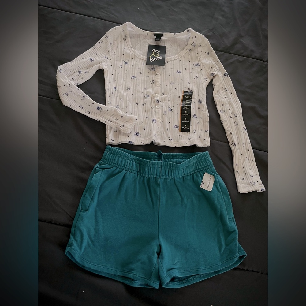 White floral top and blue shorts